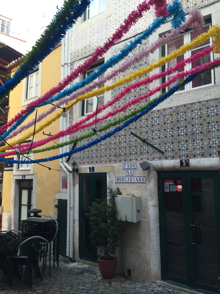 The colorful fado houses light up Lisbon at night